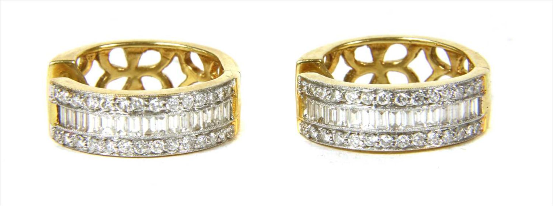 A pair of diamond set hoop earrings,