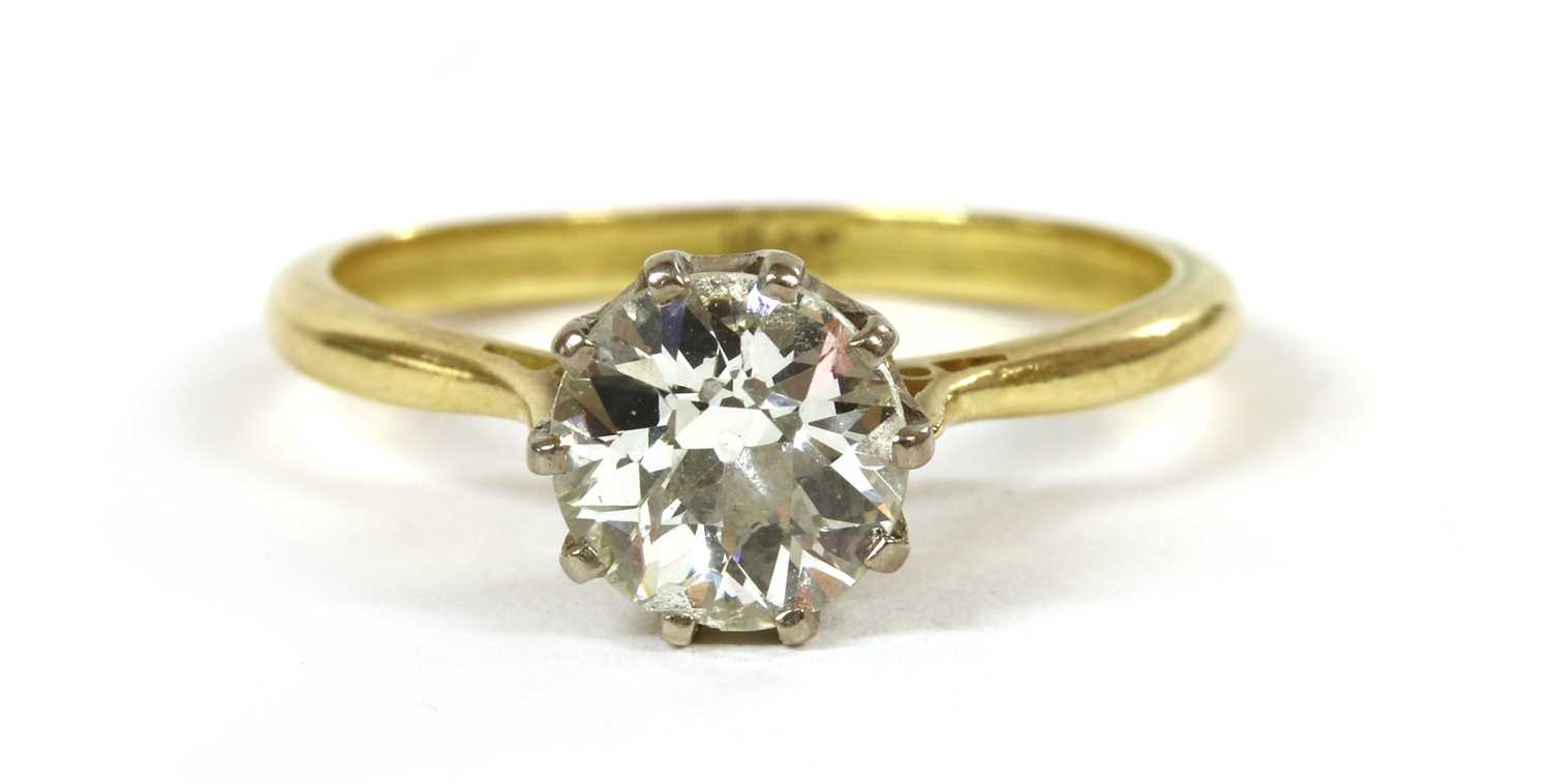 A gold single stone diamond ring,