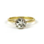 A gold single stone diamond ring,