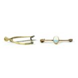 A gold wishbone brooch,