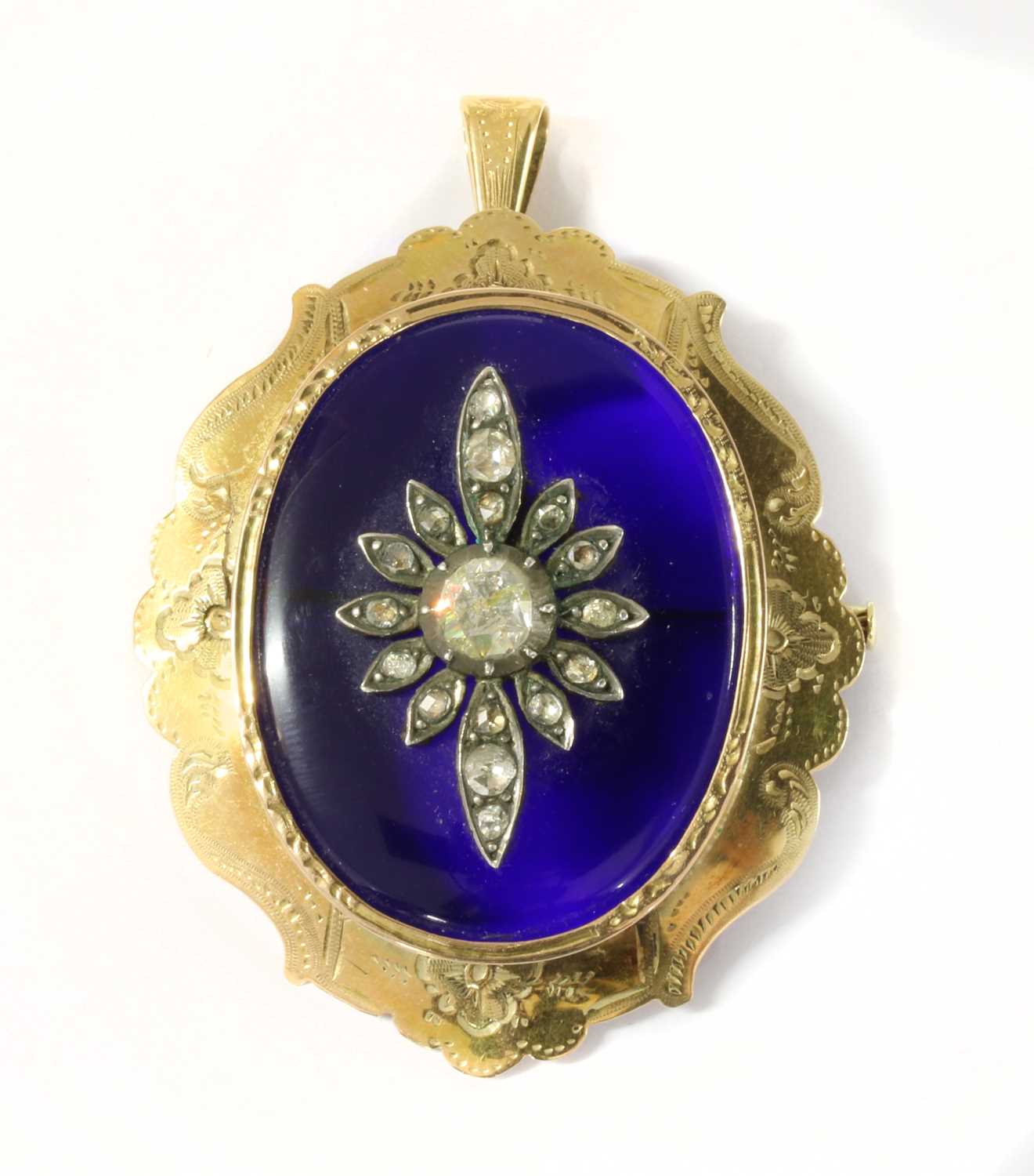 A gold glass and diamond pendant/brooch,