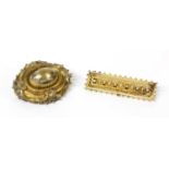 A Victorian Etruscan Revival gold shield form brooch,