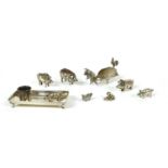 A collection of silver pig novelties,