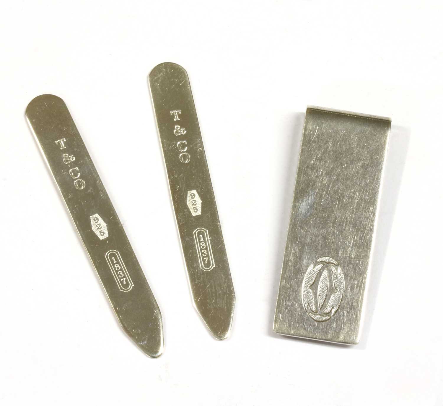 A sterling silver money clip, by Cartier,