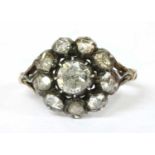 A foil-backed diamond cluster ring,