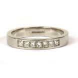 A platinum diamond half eternity ring,