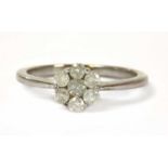 A white gold diamond daisy cluster ring,