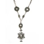 A silver opal filigree necklace,