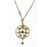 A gold garnet and split pearl pendant,