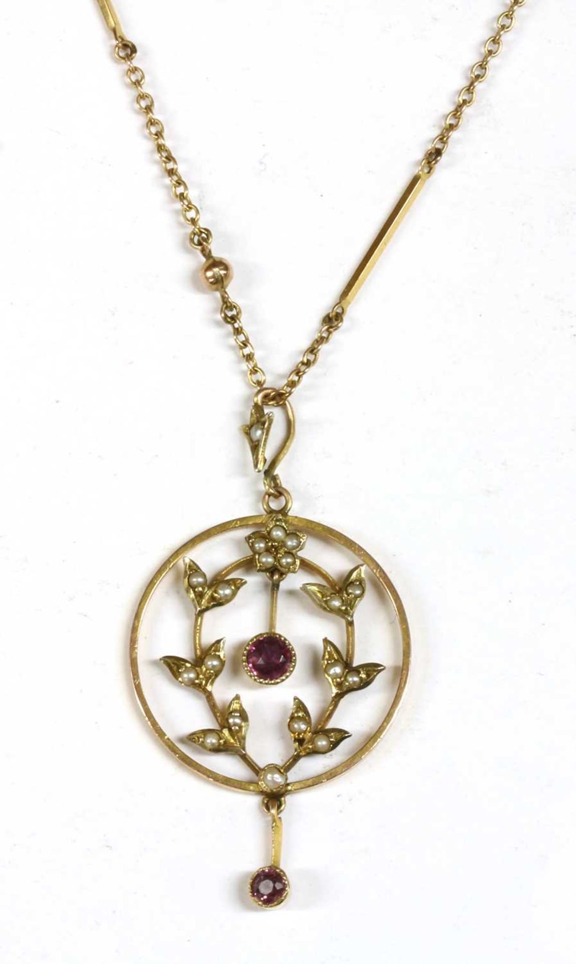 A gold garnet and split pearl pendant,