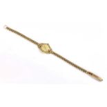 A ladies' 9ct gold Tissot mechanical bracelet watch, c.1950,