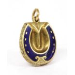 A gold enamel horseshoe locket,