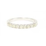 A 9ct white gold half eternity ring,