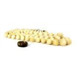 A two row graduated ivory bead necklace,