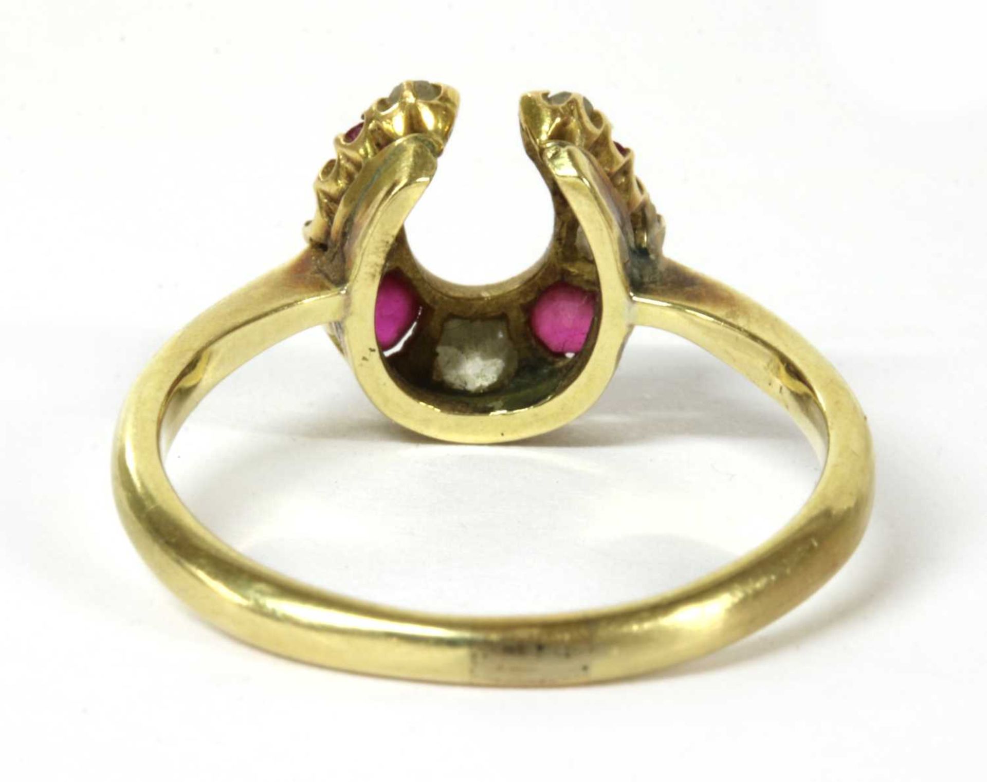 A gold diamond and ruby horseshoe ring, - Image 3 of 3