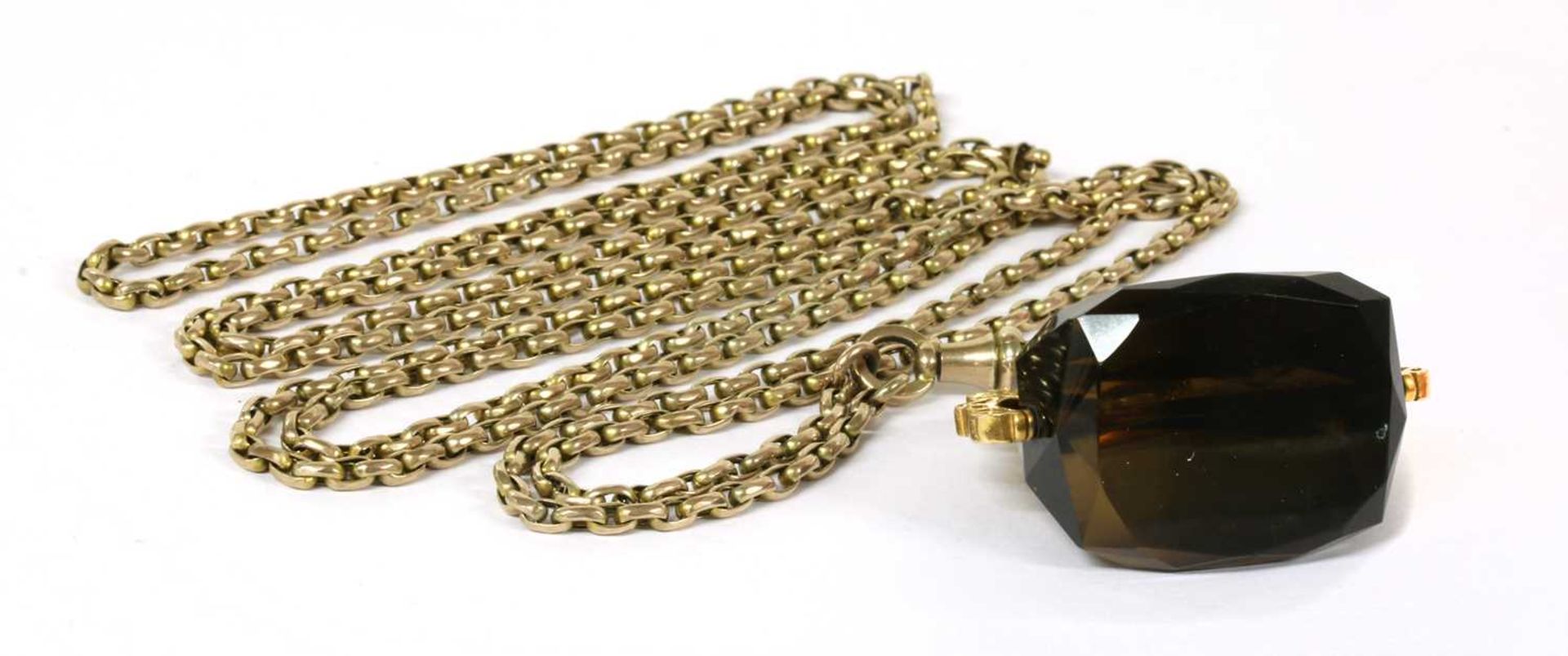 A gold oval belcher link guard chain,
