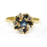 A gold sapphire and paste cluster ring,