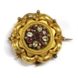 A Victorian gold gem set brooch,