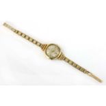 A ladies' 9ct gold mechanical bracelet watch,