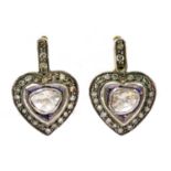 A pair of gold and silver heart shaped foil-backed diamond earrings,