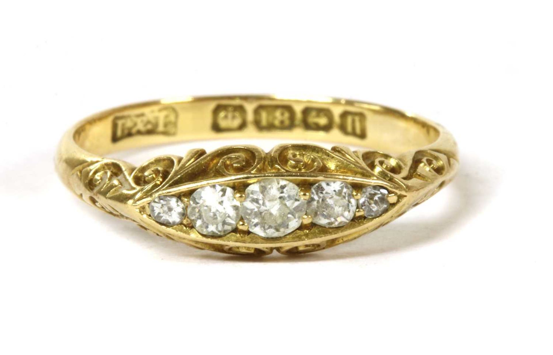 An 18ct gold boat shaped five stone diamond ring,