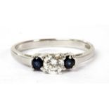 A 14ct white gold three stone diamond and sapphire ring,
