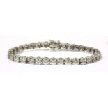 A white gold diamond line bracelet,