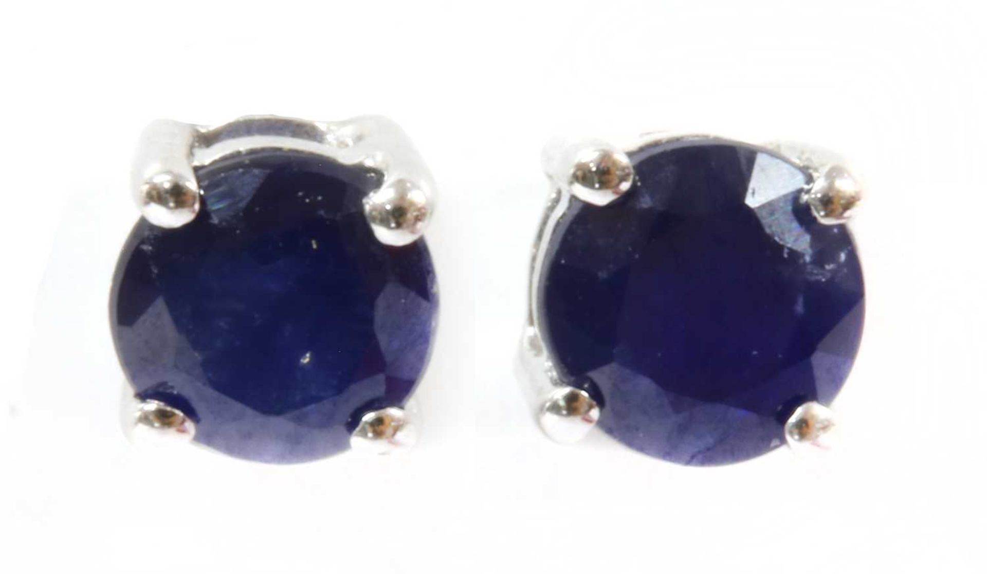 A pair of white gold sapphire stud earrings,