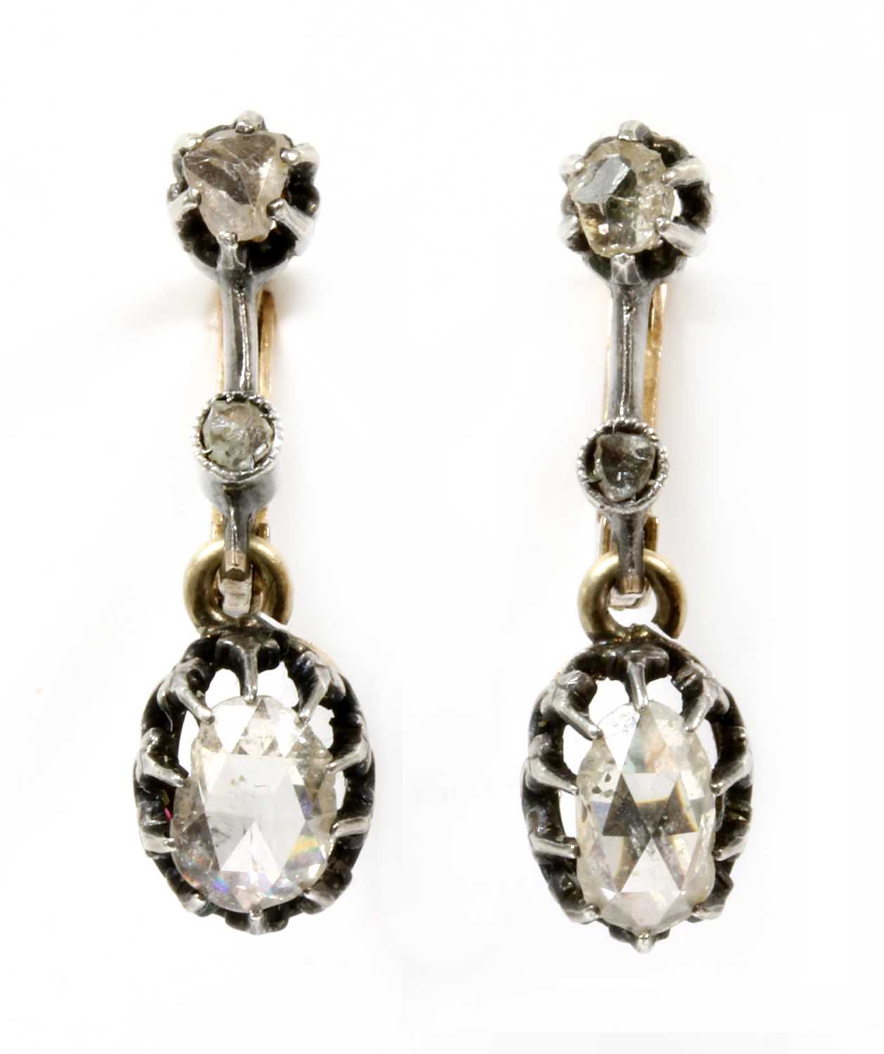 A pair of silver and gold rose cut diamond earrings,