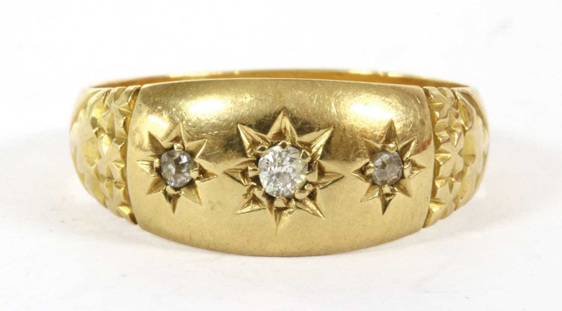 A Victorian 18ct gold three stone diamond ring,