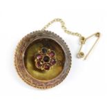 A Victorian gold garnet brooch,