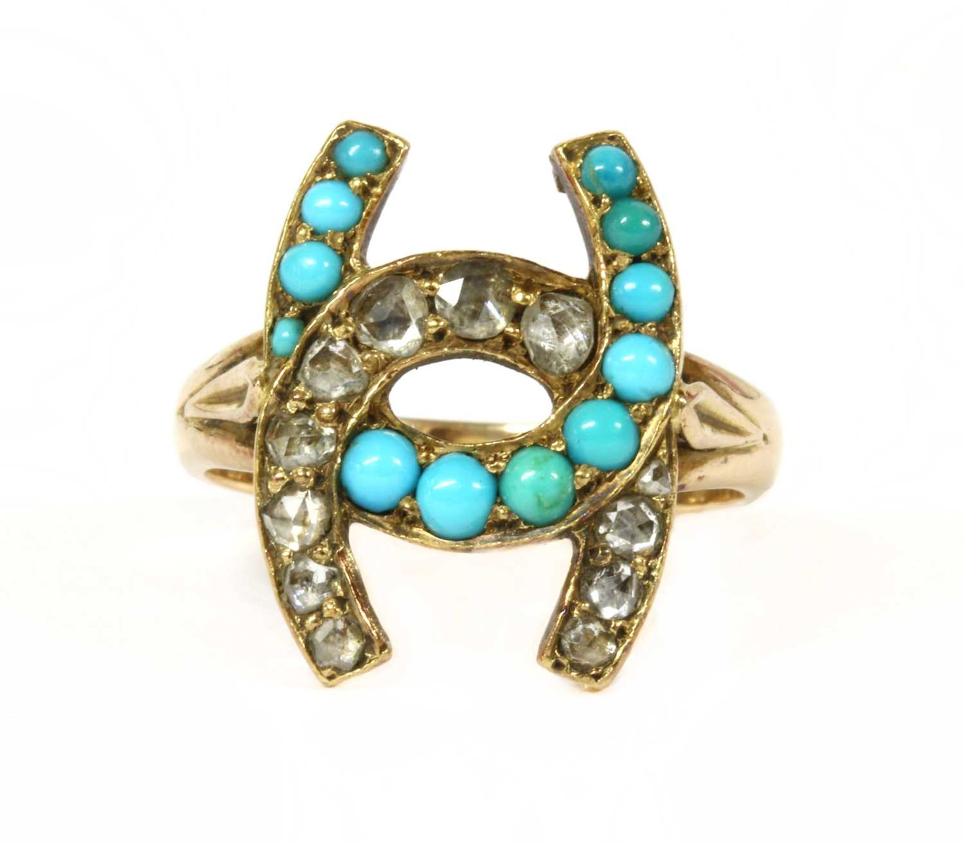 A gold diamond and turquoise horseshoe ring,