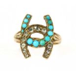 A gold diamond and turquoise horseshoe ring,