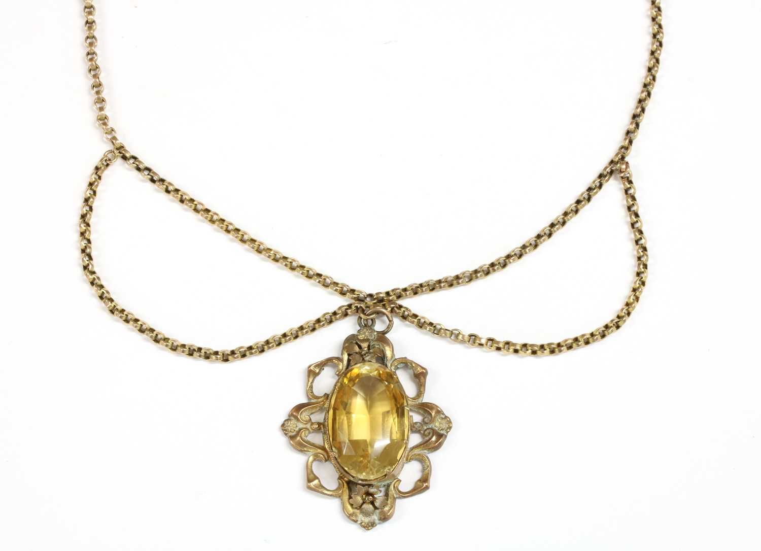 A gilt metal citrine pendant,