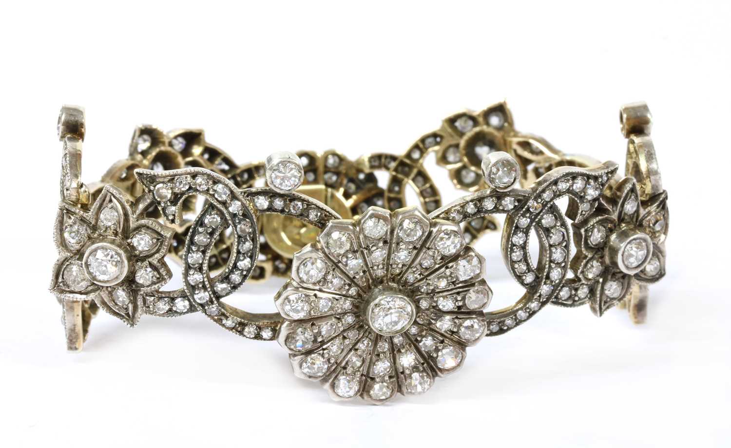 A gold and silver diamond set bracelet,