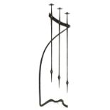 A wrought iron three-branch standing candelabra,