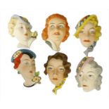 Five Art Deco Czechoslovakian pottery wall masks,