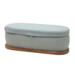 A walnut and upholstered ottoman,