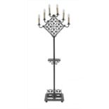 A wrought iron standard lamp,