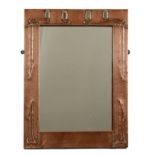 An Arts and Crafts Glasgow School copper wall mirror,