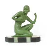 An Art Deco patinated spelter figure of a girl,