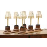 A pair of oak three-light table lamps,