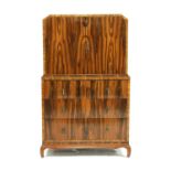 An Art Deco Macassar veneered tallboy,