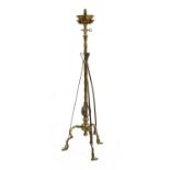An Arts and Crafts brass and copper-mounted standard lamp,