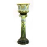 A Burmantofts faience glazed jardinière on stand,