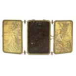 A brass and embossed triptych mirror,