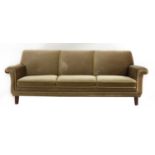 A green velour three-seater settee,