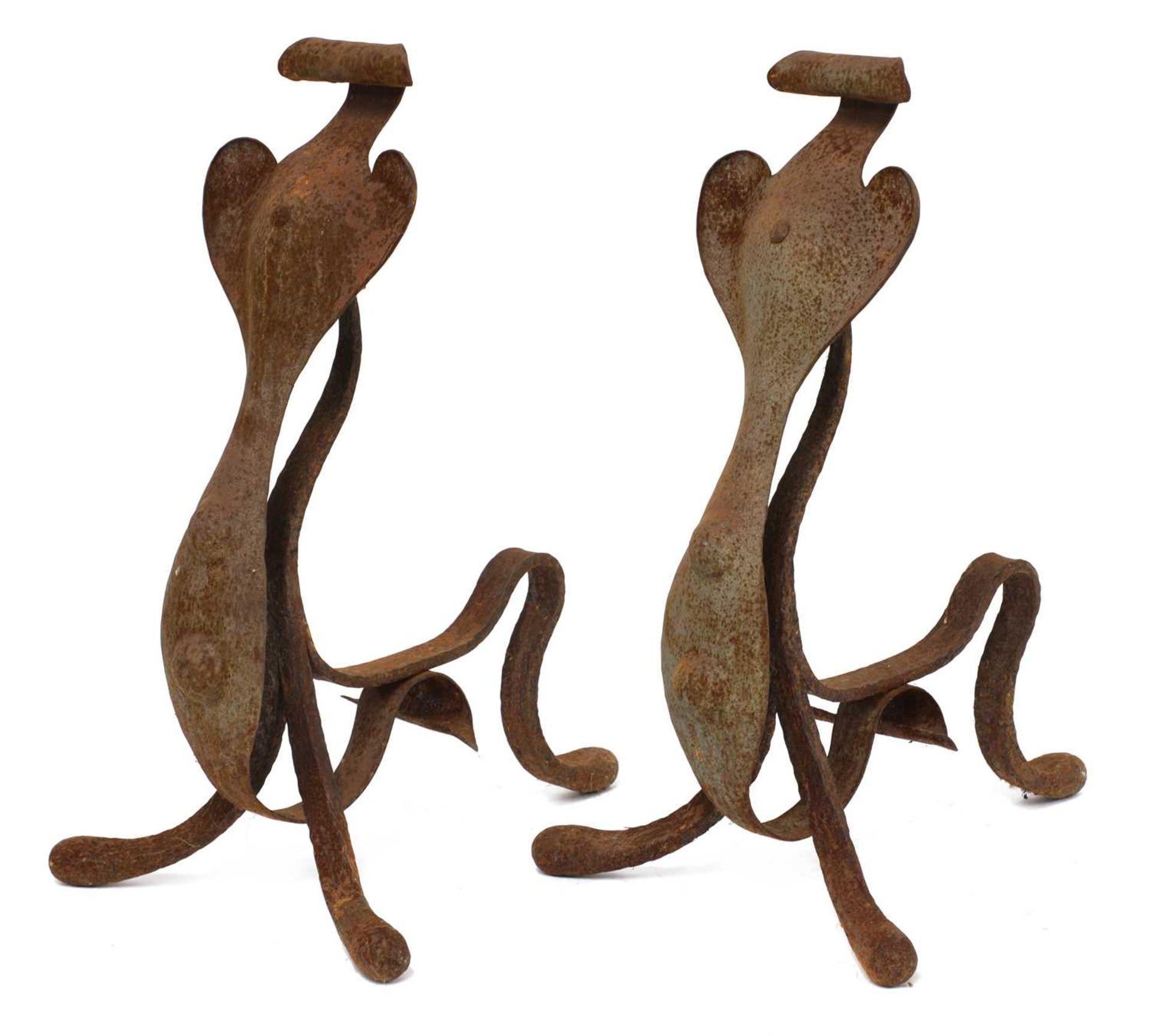 A pair of Arts and Crafts wrought iron fire dogs,