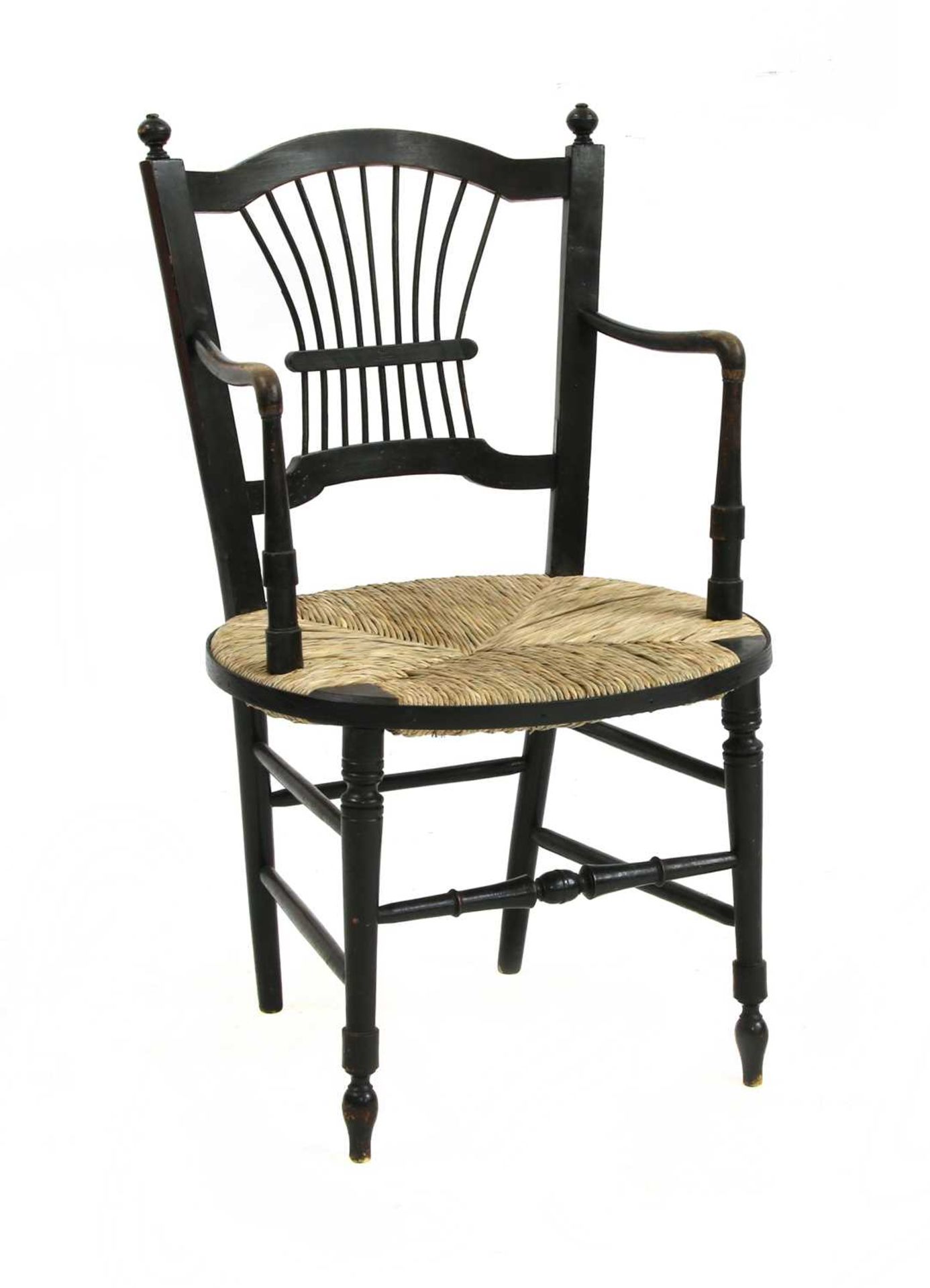 A Morris & Co. ebonised elbow chair,