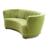 A Danish green velour 'banana' settee,